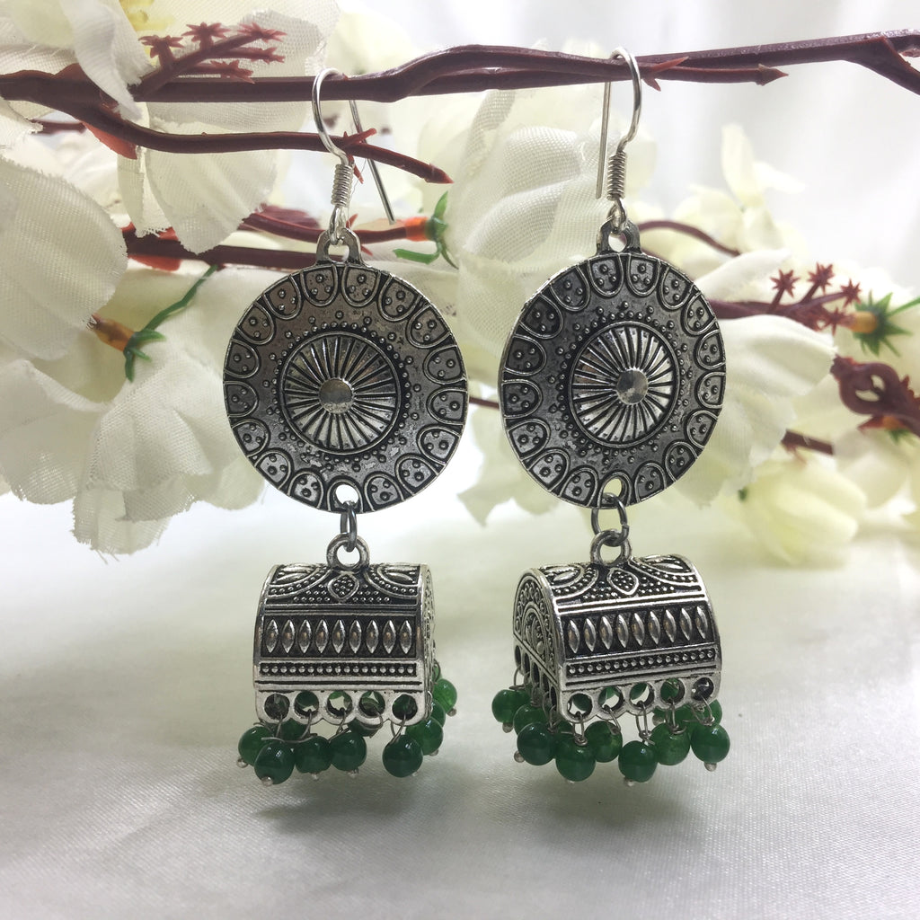 Asian Arts   Rajasthani silver earrings with turquoise  by Asian Arts  This earring possesses a beautiful turquoise stone on each side The stone  has a rough natural look on it